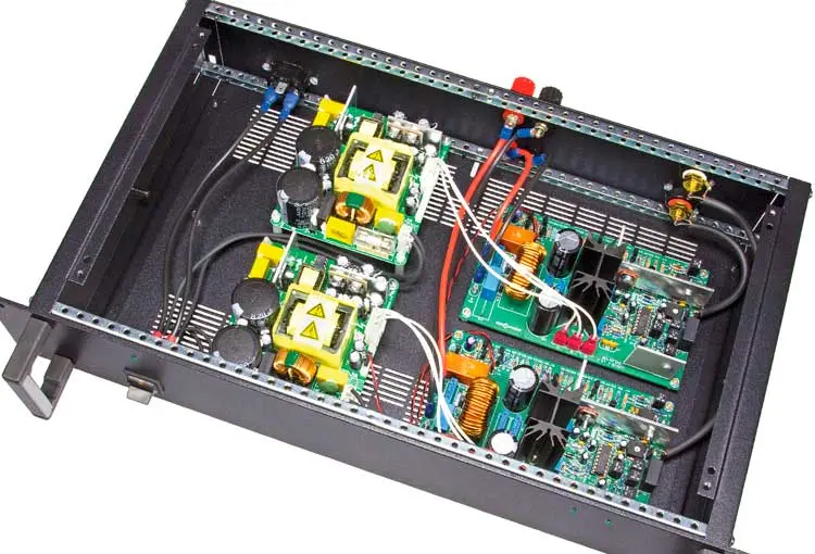 Two amplifier boards and two switching power supplies fitted in an enclosure